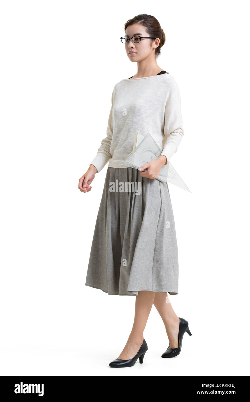 Jeune enseignante walking Banque D'Images