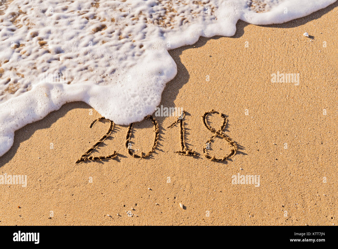 Numéro d'nscription à la main sur du sable de mer 2018 Banque D'Images