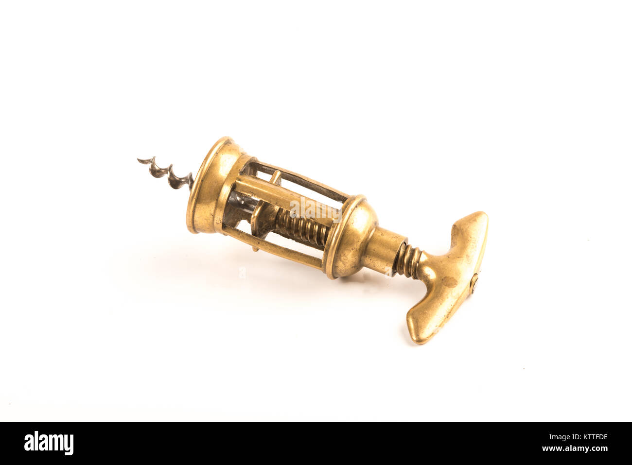 Tire-bouchon en laiton sur fond blanc Banque D'Images