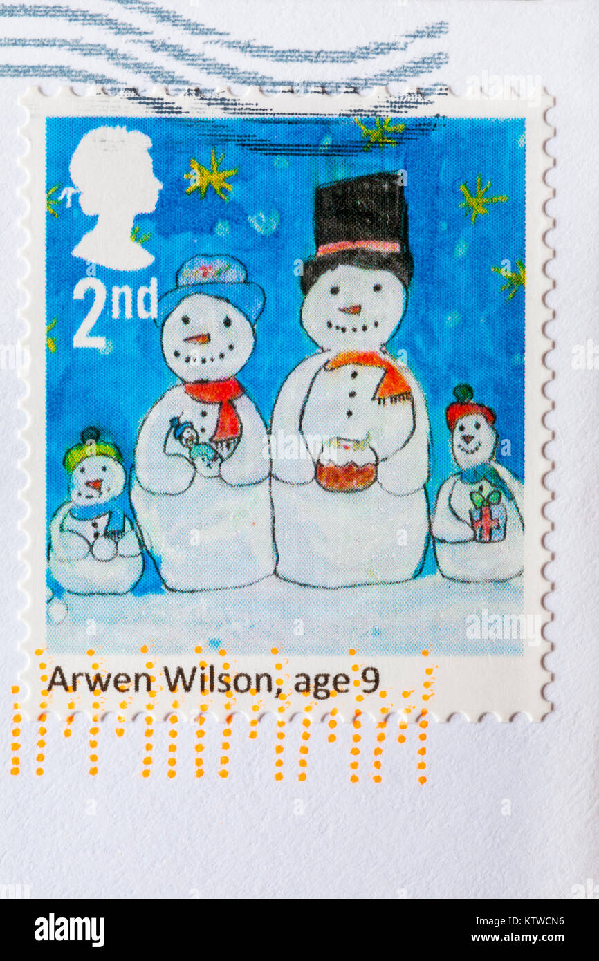 2e classe timbres de Noël avec les bonshommes sur bloqué sur enveloppe Banque D'Images