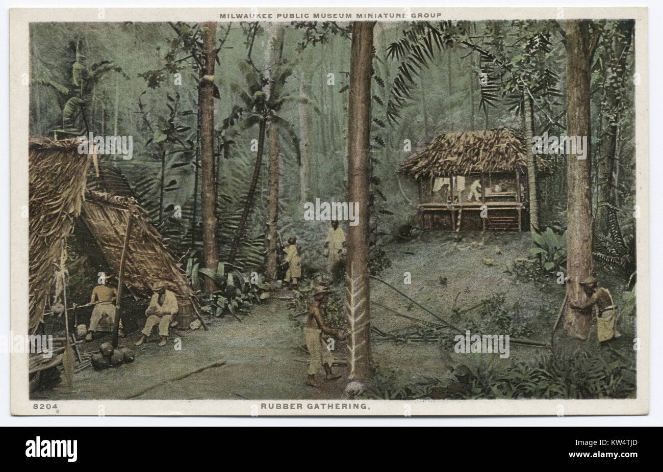 Carte postale montrant le caoutchouc rencontre des travailleurs dans la forêt, 1914. À partir de la Bibliothèque publique de New York. Banque D'Images