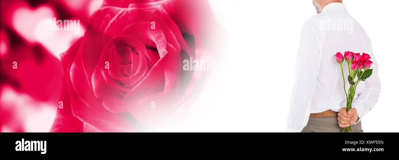 Valentines homme tenant des roses avec amour coeur fond Banque D'Images
