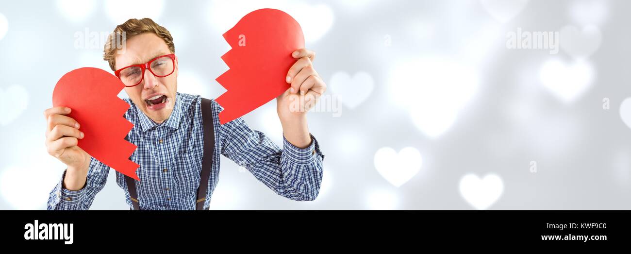 Homme de Saint-Valentin cassant coeur avec amour coeur fond Banque D'Images