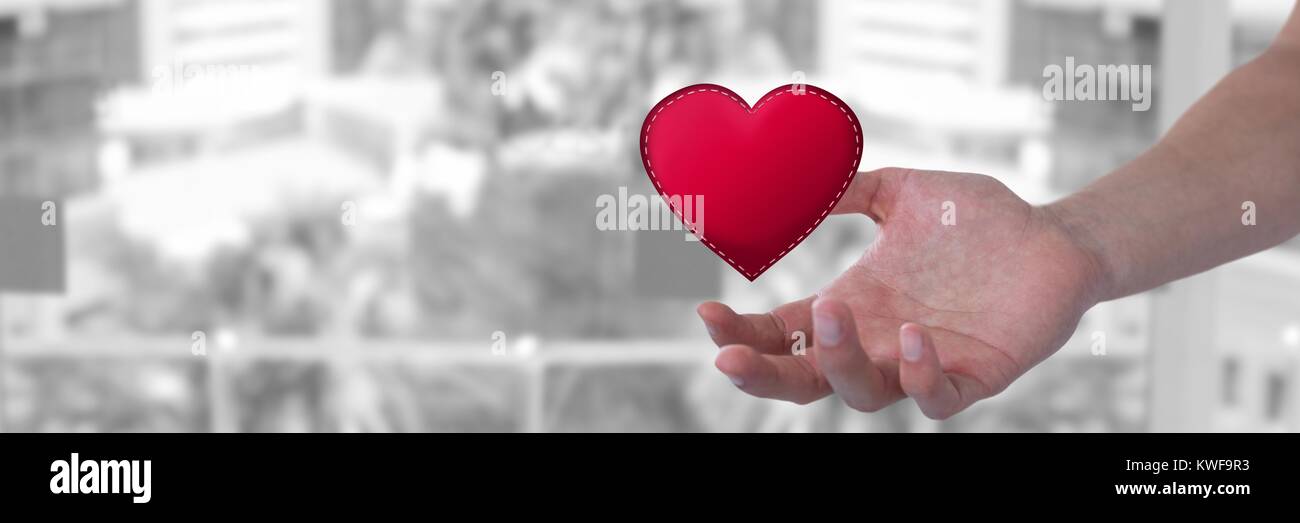 main ouverte et coeur par ville Banque D'Images