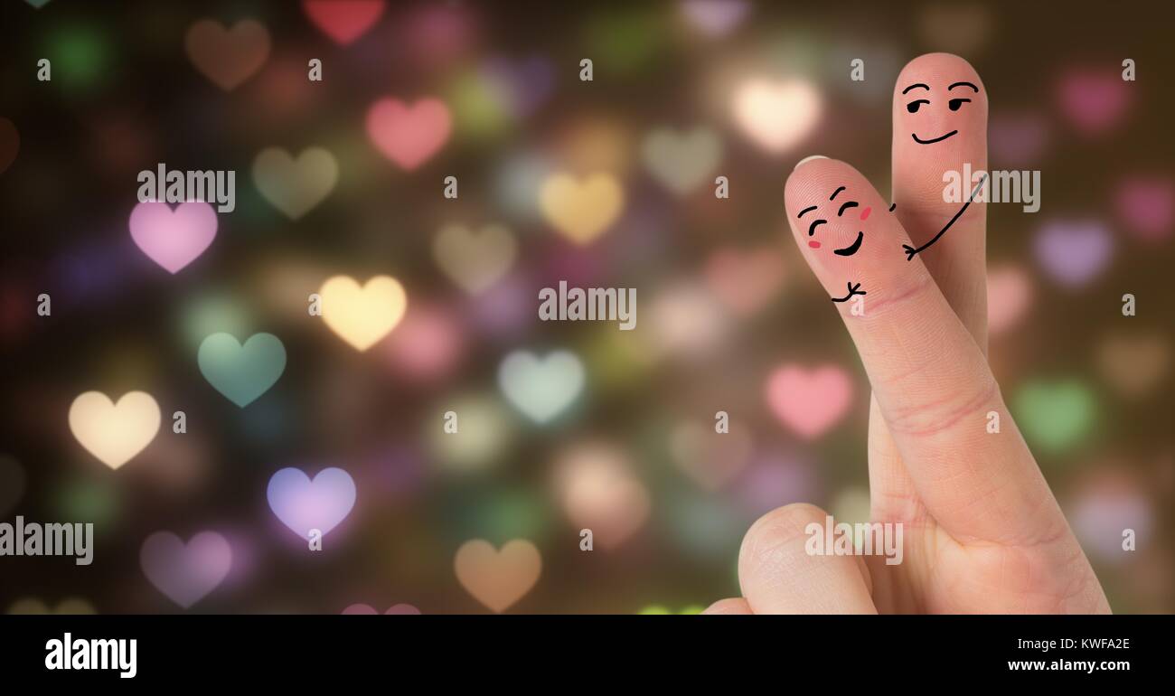 Les doigts de la Saint-Valentin aiment couple et bokeh lumières étincelantes Banque D'Images