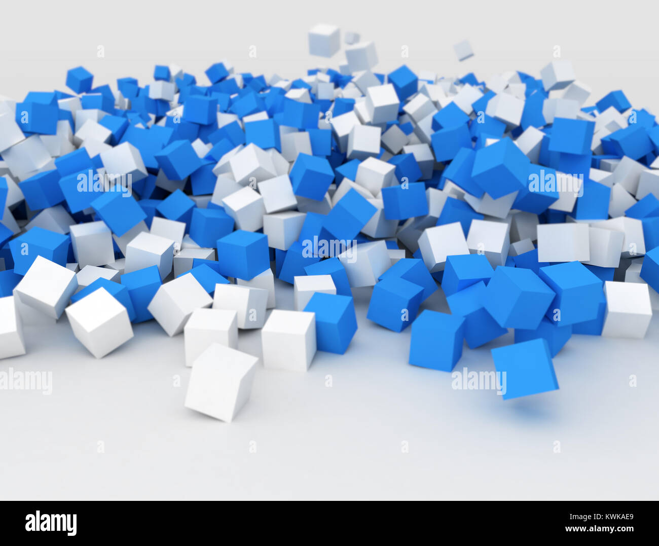 La chute des cubes bleu et blanc dans un gros tas Banque D'Images