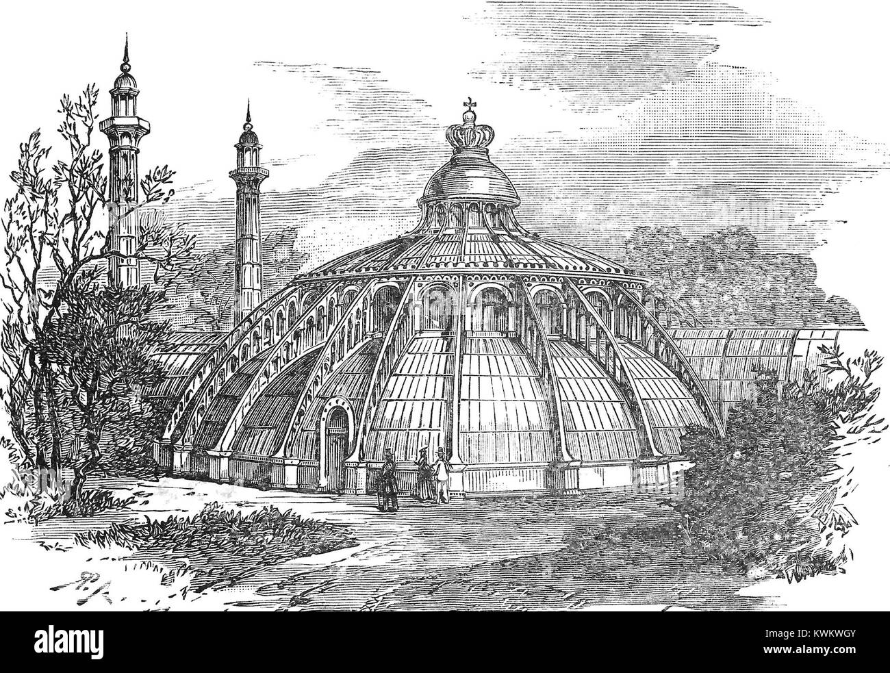 Photographie du jardin d'hiver des serres royales de Laeken en Belgique. L’image montre les dômes de verre architecturaux et les collections de plantes exotiques faisant partie du patrimoine botanique du domaine royal. Banque D'Images