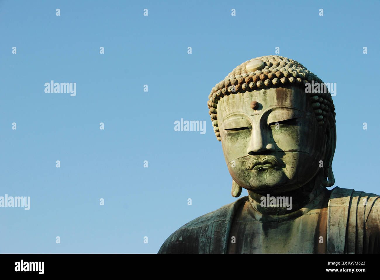 Close-up of statue Bouddha Géant contre ciel clair Banque D'Images