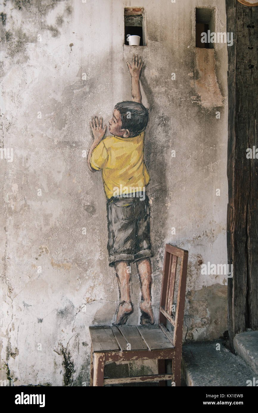 Street art par Ernest Zacharevic à Georgetown, Penang, Malaisie. Banque D'Images