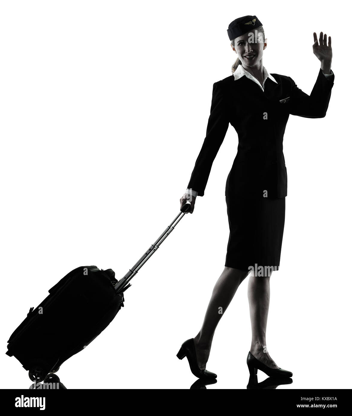 Une hôtesse de l'équipage de cabine de race blanche femme saluant isolé sur fond blanc en silhouette Banque D'Images