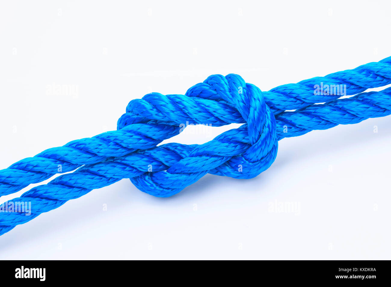 Cross knot, weaver noeud ou samaritain de noeud dans la corde bleu Banque D'Images