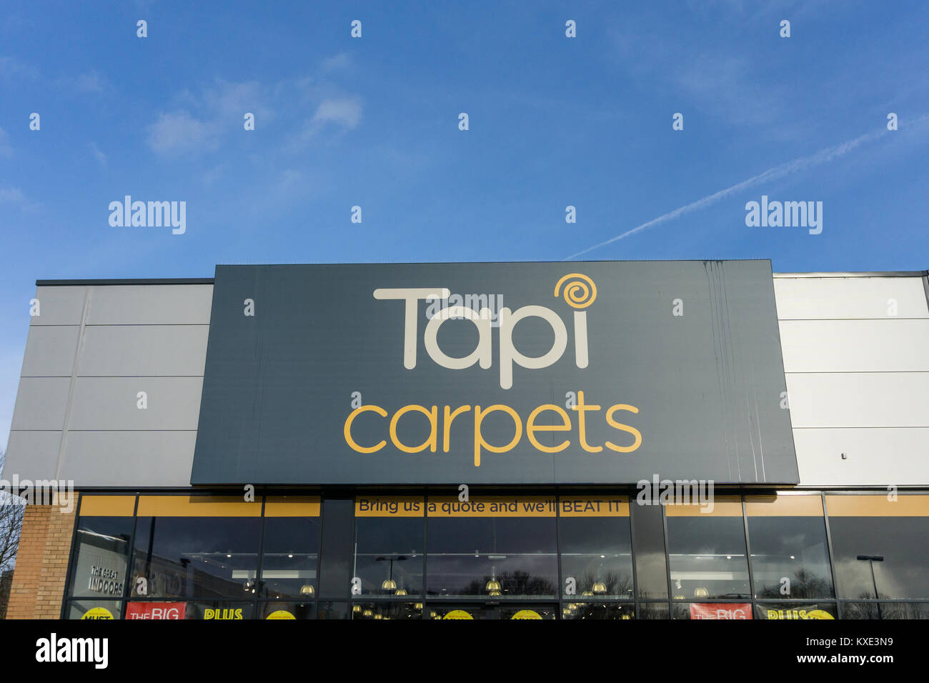 L'avant du magasin de Tapis Tapi, spécialistes dans les tapis, les planchers laminés et les revêtements de sol en vinyle ; Nene Valley Retail Park, Northampton, Royaume-Uni Banque D'Images