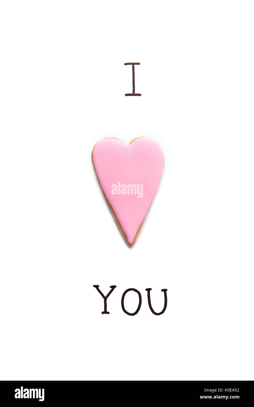 Carte de vœux avec je t'aime l'inscription et en forme d'coeur cookie on white Banque D'Images