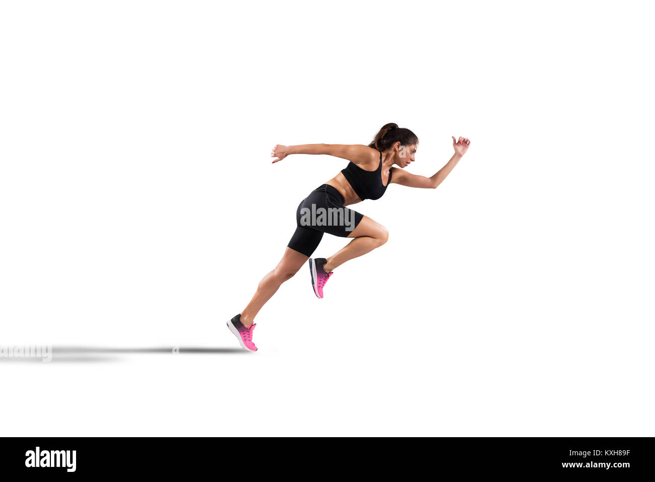 Athletic woman runner isolé sur fond blanc Banque D'Images