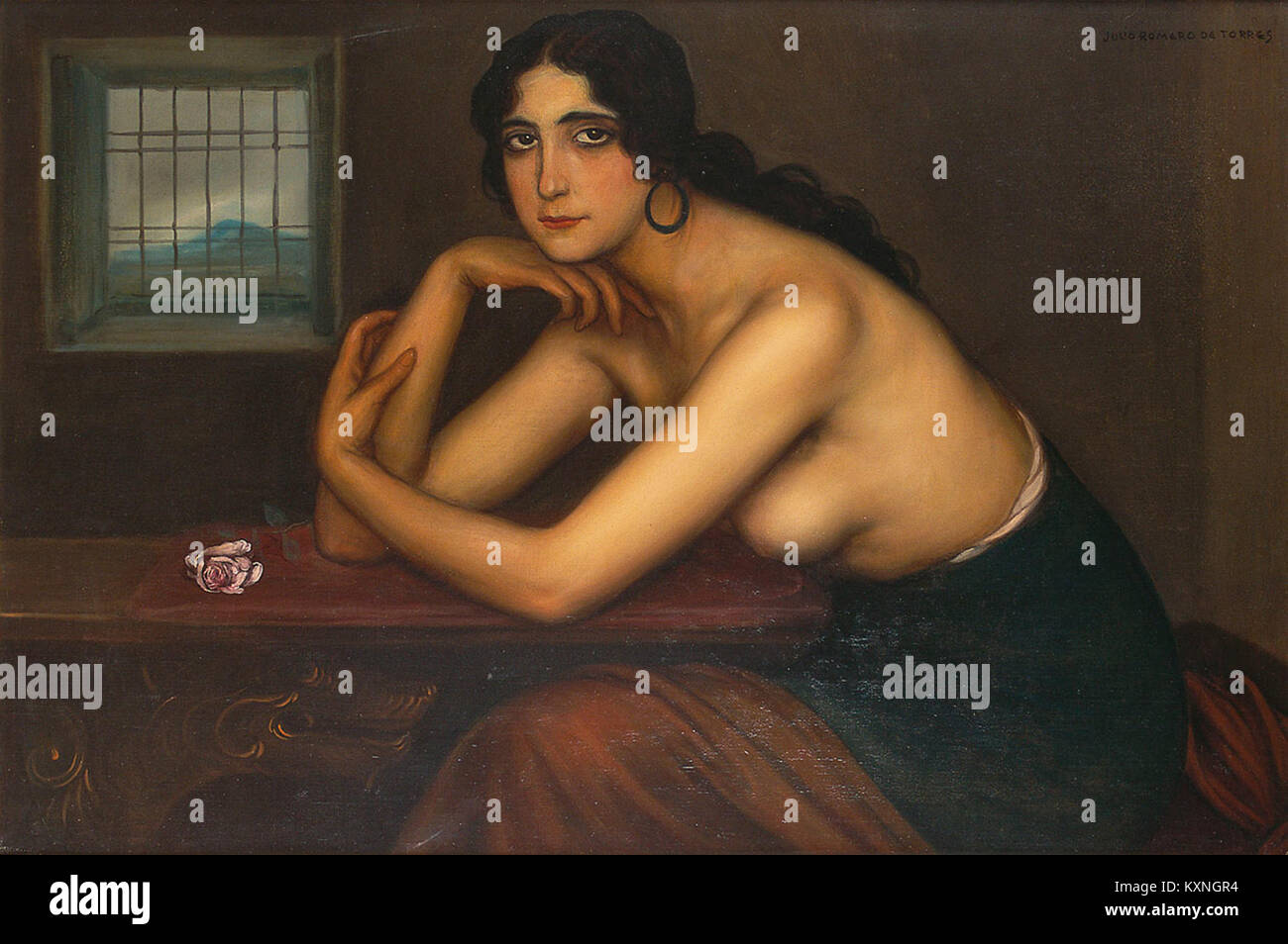 Carmen de Córdoba est une peinture célèbre de Julio Romero de Torres, mettant en valeur le portrait d'une femme avec une forte intensité émotionnelle. L'œuvre d'art est connue pour son utilisation frappante de la lumière et de l'ombre, reflétant l'exploration de l'identité espagnole et de l'émotion de l'artiste Banque D'Images