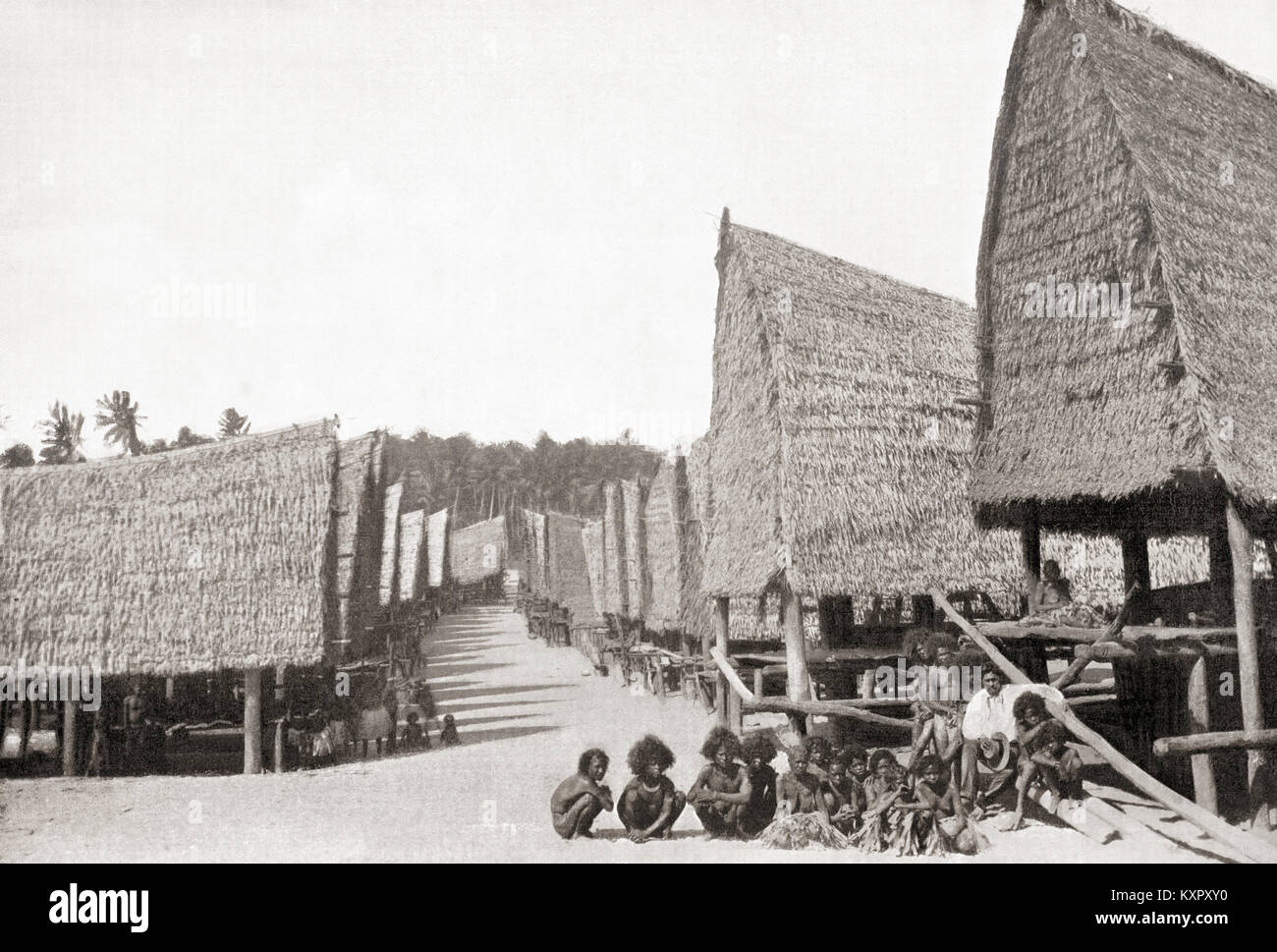Un village en Guinée, l'Océanie à la fin du xixe siècle. Des merveilles du monde, publié vers 1920. Banque D'Images