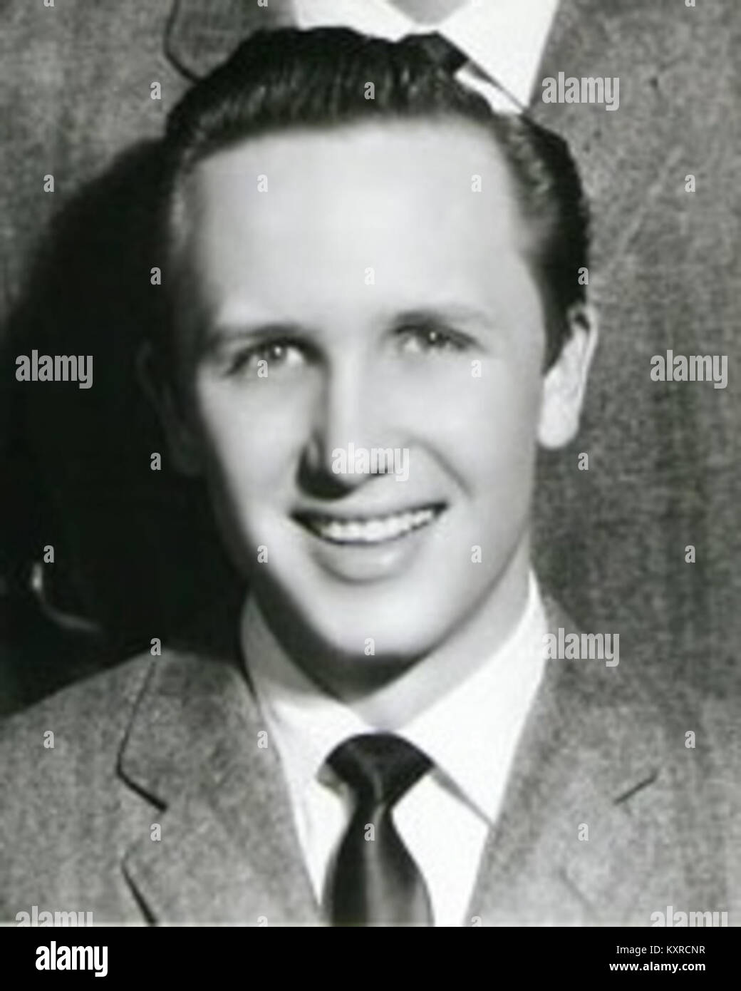 Ce portrait publicitaire en noir et blanc, vers 1957–58, met en vedette le musicien américain de rock and roll Buddy Holly et son groupe The Crickets pour Coral Records. Il met en valeur l’image promotionnelle du groupe au début de l’ère rock. Banque D'Images