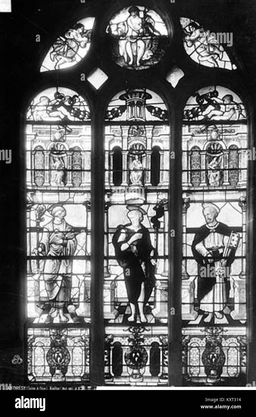 Cette photographie montre un autre vitrail de l'église Saint-Germain à Andrésy, en France, soulignant son iconographie religieuse et l'artisanat du verre médiéval français Banque D'Images