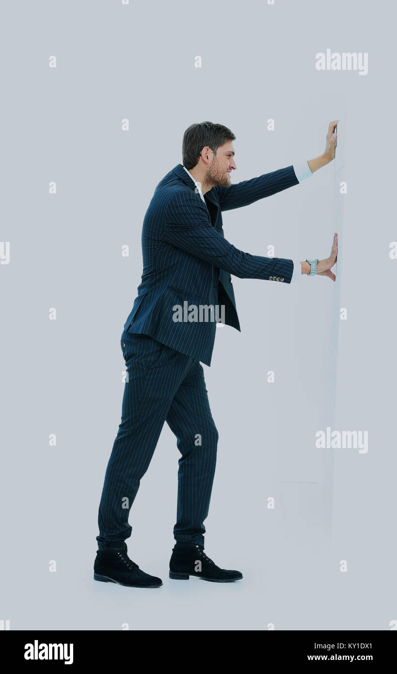 L'homme d'affaires poussant le mur. Banque D'Images