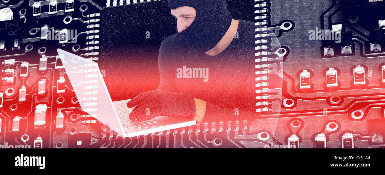 Composite image of burglar holding laptop permanent Banque D'Images