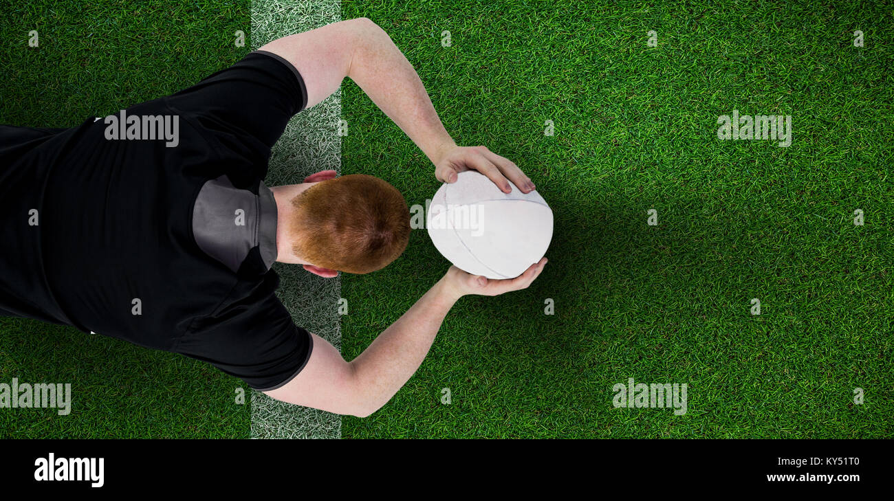 Image composite de rugby player sur le point de lancer un ballon de rugby Banque D'Images