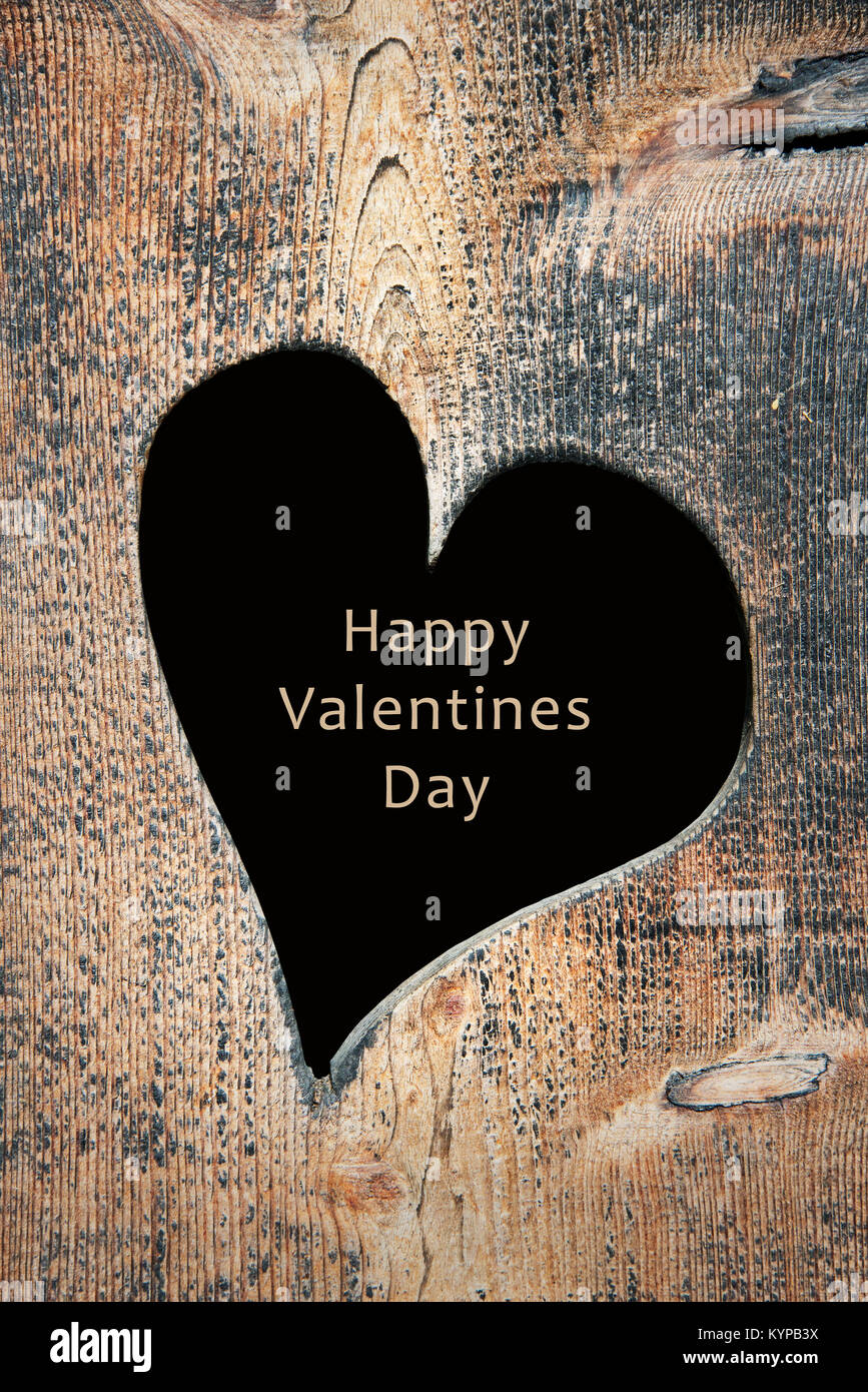 Carte de Saint Valentin, fond en bois avec une forme de coeur Banque D'Images