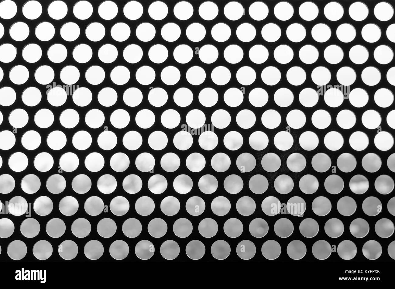 Fond noir et blanc d'une grille de points. Schéma des trous ronds vintage style. Site web Photo pour slider. Banque D'Images