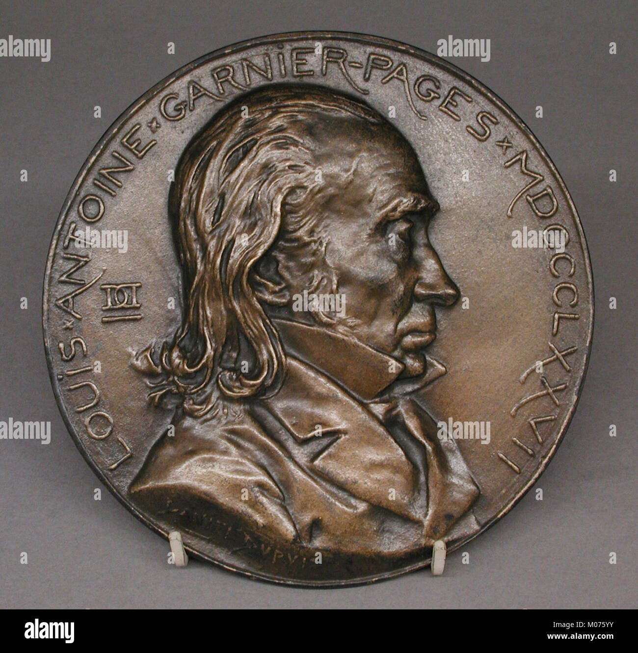 Ce portrait du XIXe siècle représente Louis-Antoine Garnier-pages, figure politique française, montrant ses traits faciaux et ses tenues vestimentaires. L'œuvre reflète son importance historique et son rôle politique en France. Banque D'Images