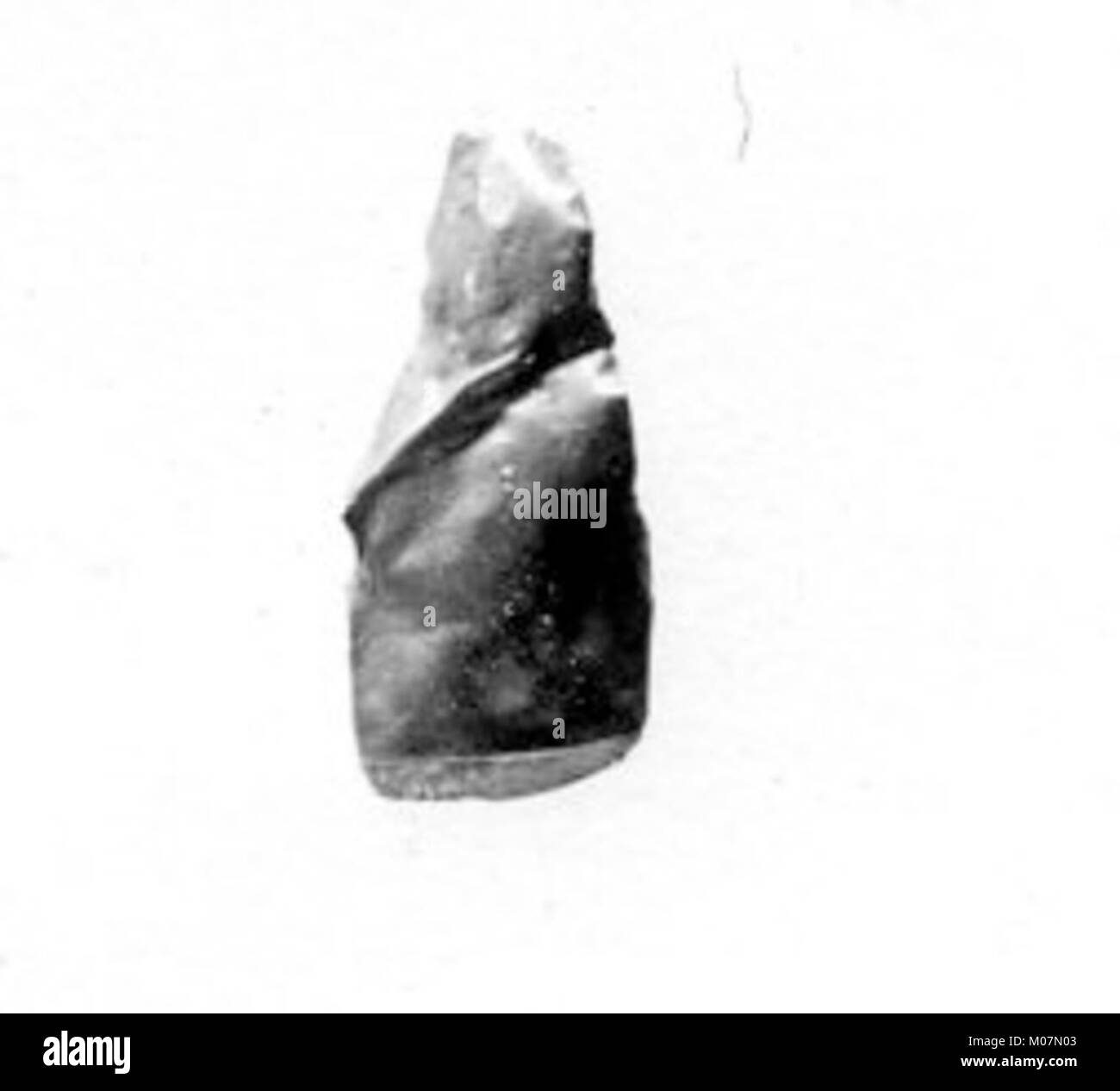 Amulette buccale, utilisée dans les anciens contextes rituels ou funéraires, démontrant des qualités symboliques et protectrices, conservée comme artefact égyptien. Banque D'Images