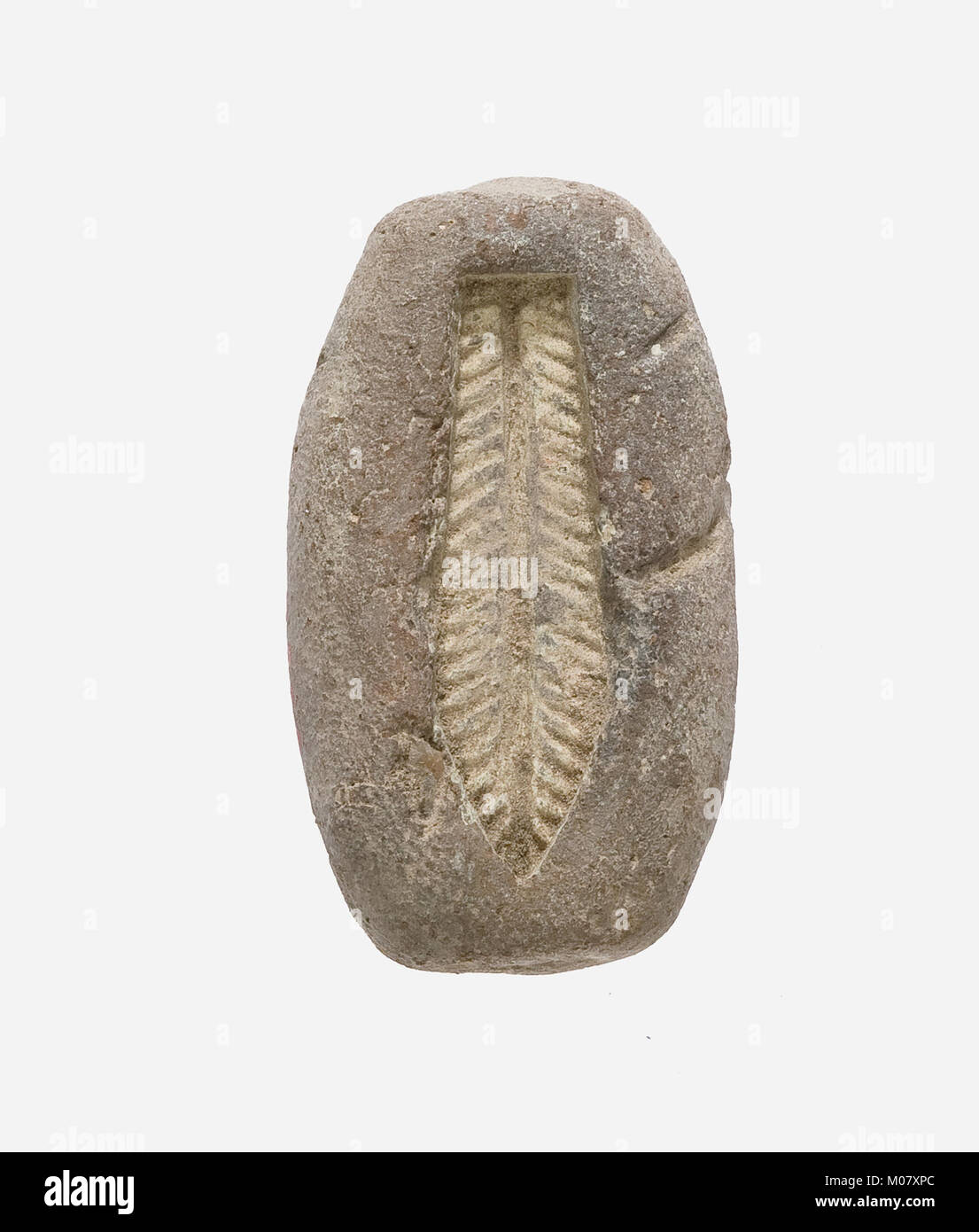 Un moule pour perles de feuilles démontrant les anciennes techniques de fabrication de perles et l'artisanat de bijoux. Banque D'Images