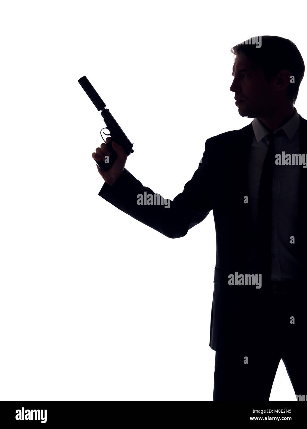 Silhouette de gars en costume d'affaires avec arme à la main Banque D'Images