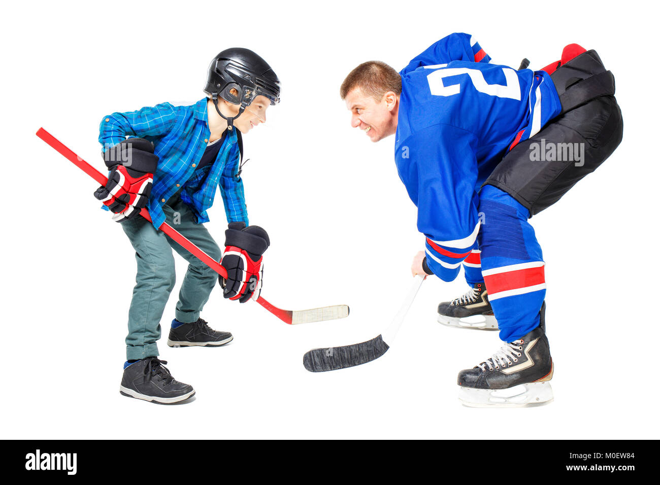 Les joueurs de hockey sur glace Concept isolé sur fond blanc. Man and boy playing game Banque D'Images