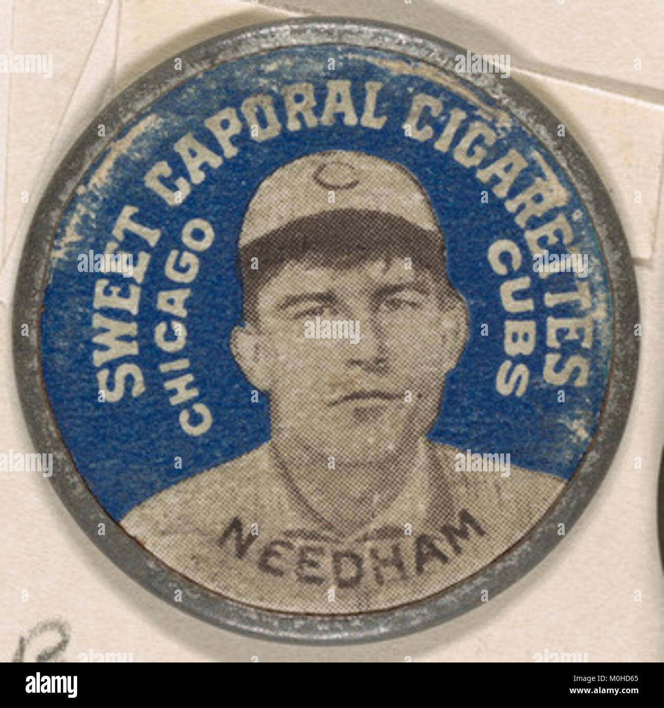 Cette image de la série Domino Discs représente Needham des Cubs de Chicago, mettant en évidence le baseball américain du début du XXe siècle et son importance culturelle et historique. Banque D'Images