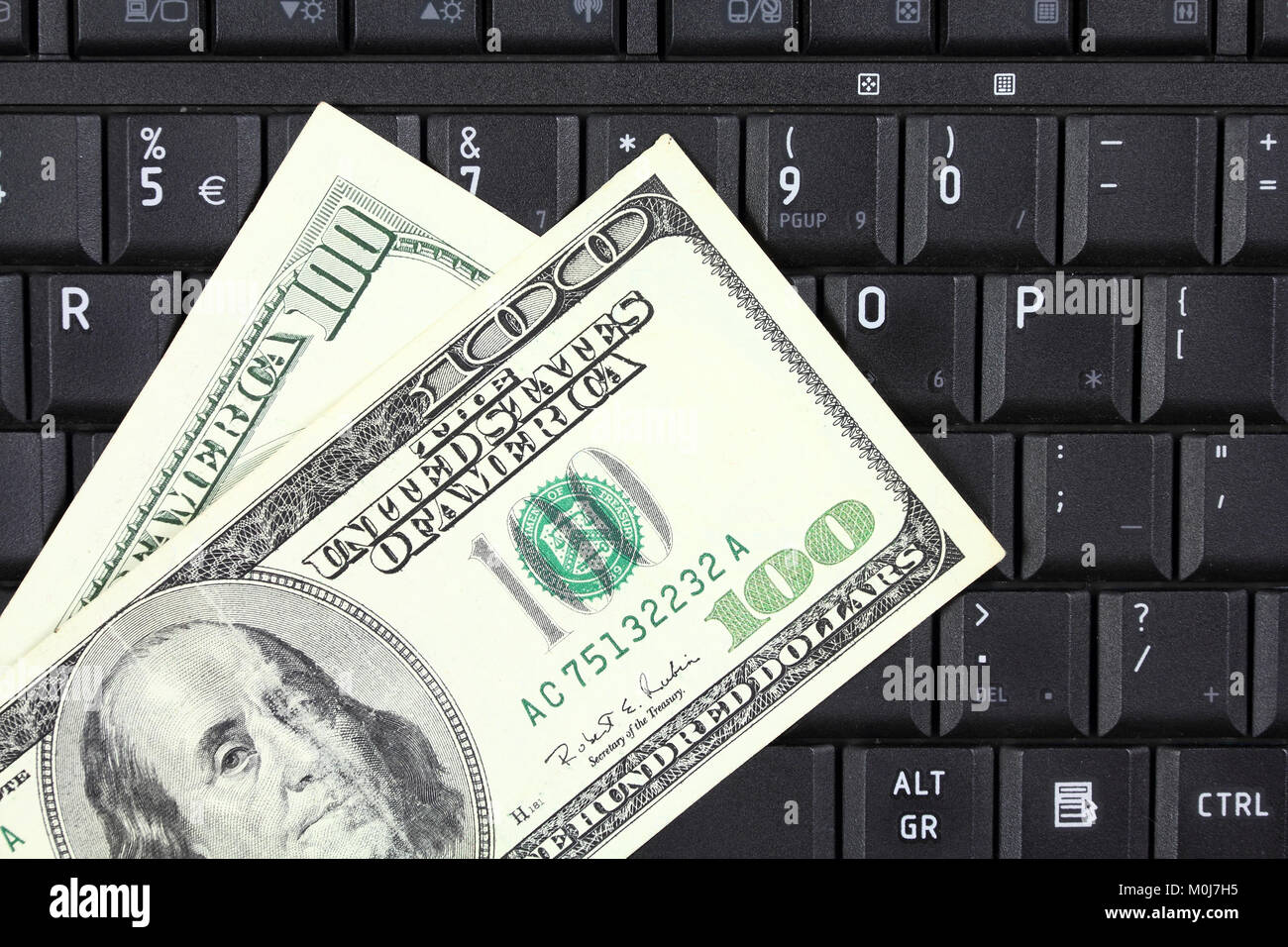 Des affaires en ligne - clavier portable et dollars US Banque D'Images
