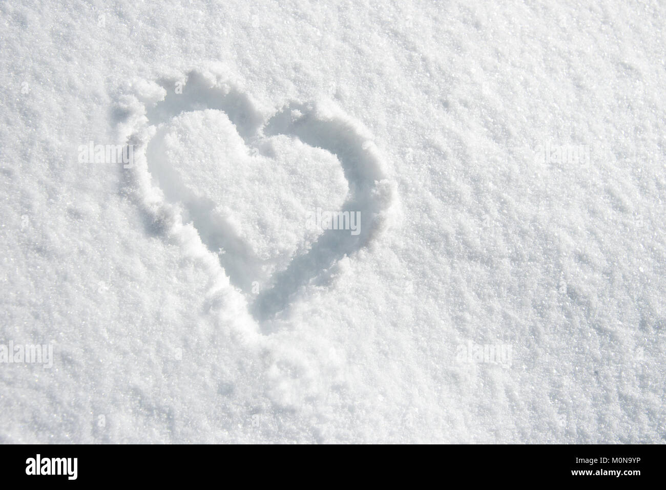 Close up of a heart n la neige Banque D'Images