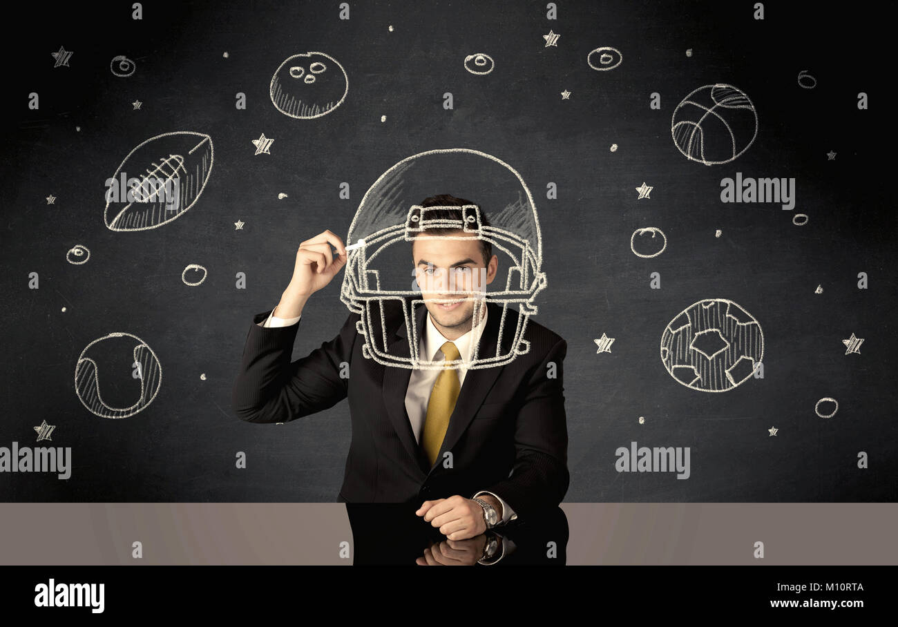 Un diplômé du collège heureux rêver d'être un sportif pendant le dessin casque et balle dans l'espace concept Banque D'Images