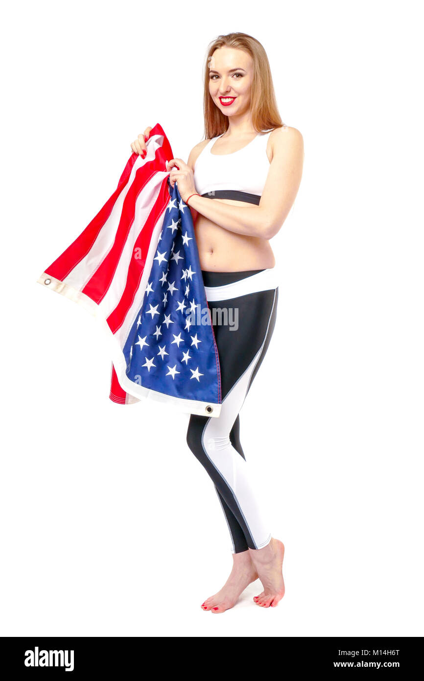 Le drapeau Américain est dans les mains d'un blond brillant. Banque D'Images