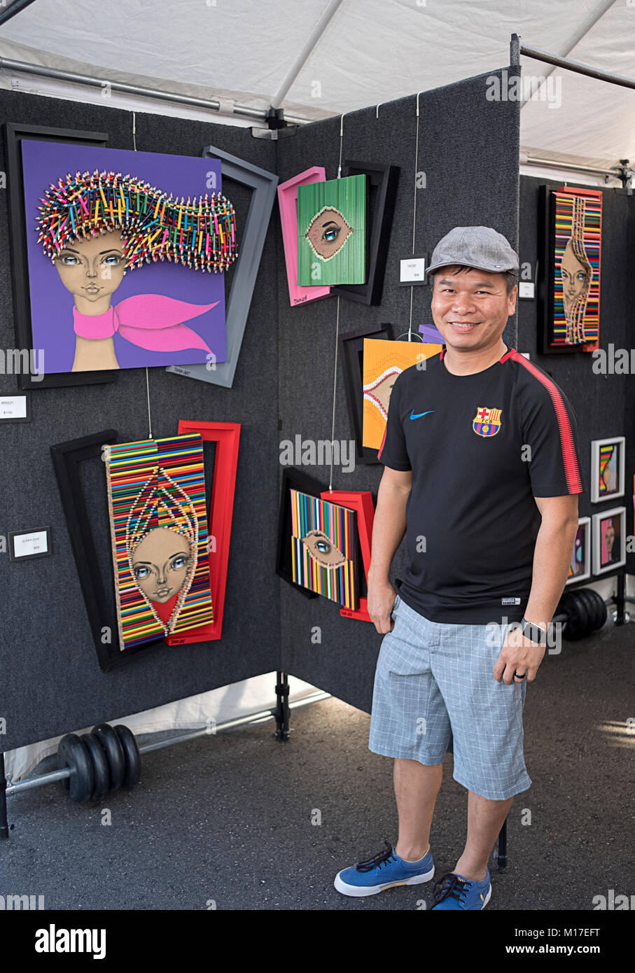 Portrait de l'artiste chinoise Tshun Sip Ng qui utilise des crayons de couleurs dans son travail. Lors d'une foire d'art en plein air dans Dleray Beach, en Floride. Banque D'Images