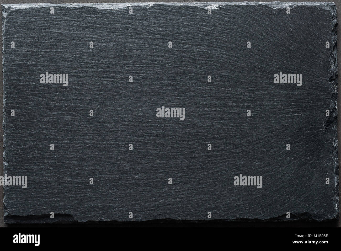Texture de fond en ardoise noire Vue de dessus de table. La cuisson des aliments, menu de restaurant, tableau arrière-plan du menu avec copie espace pour le texte. Banque D'Images