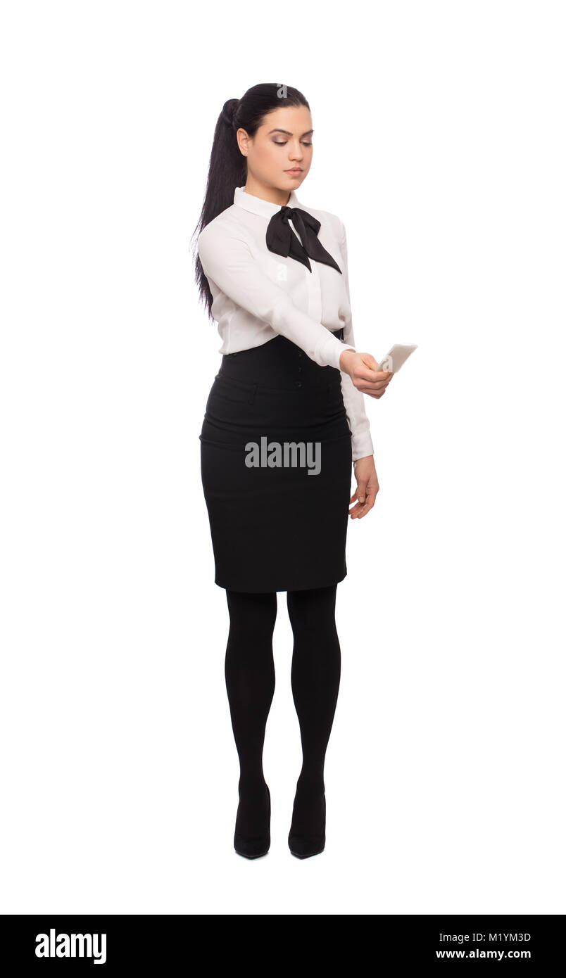 Young caucasian woman en tenue de cérémonie avec carte d'accès touchant la sécurité imaginaire terminal, isolated on white Banque D'Images