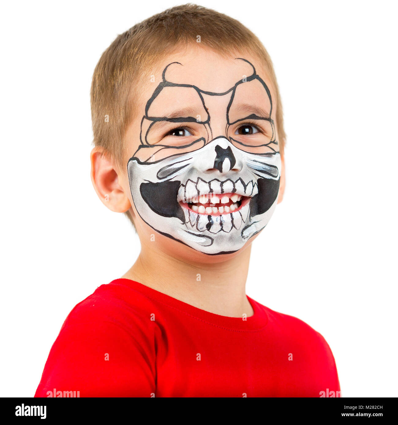 Portrait d'un enfant heureux dans le style de l'Halloween. Le visage du garçon dans l'aqua-crasse Banque D'Images