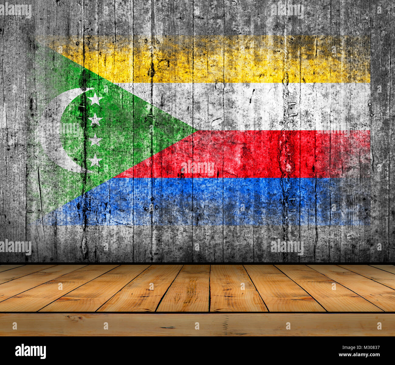 Drapeau Comores peint sur la texture de fond en béton gris avec plancher en bois Banque D'Images