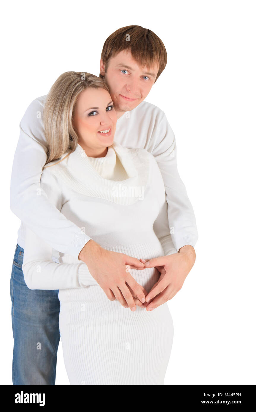 Coeur de mains sur ventre de femme enceinte Banque D'Images