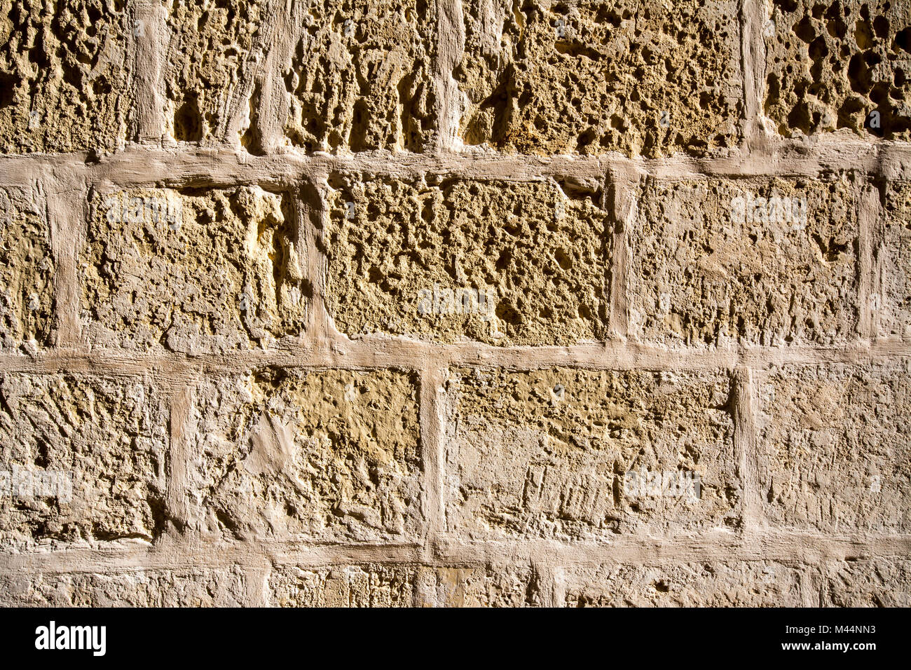 - Texture mur de briques de calcaire de lumière Banque D'Images