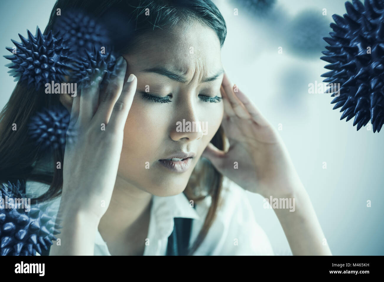 Image composite de nervous businesswoman holding sa tête Banque D'Images