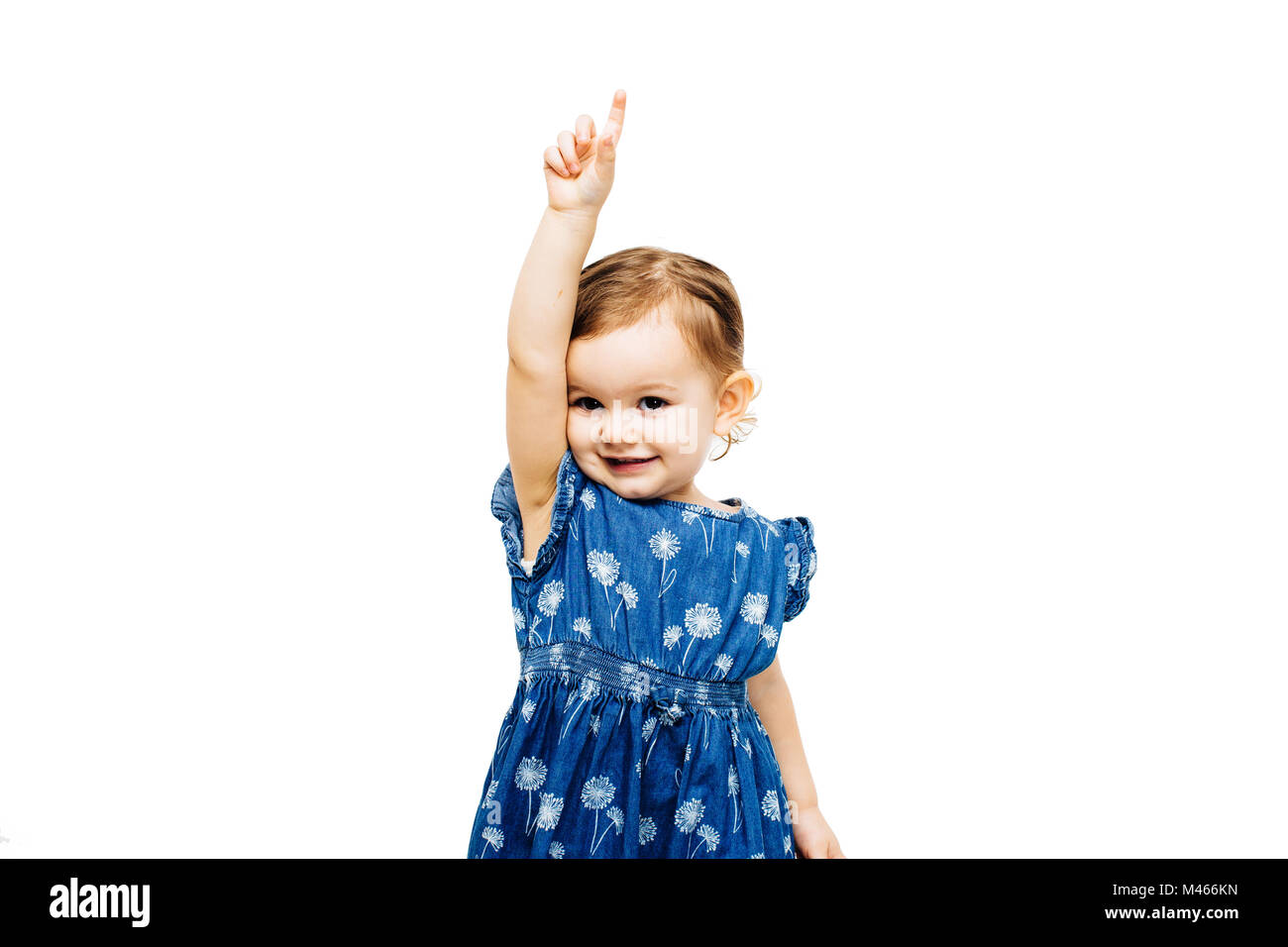 Girl raising hand avec l'index pointant vers le haut Banque D'Images