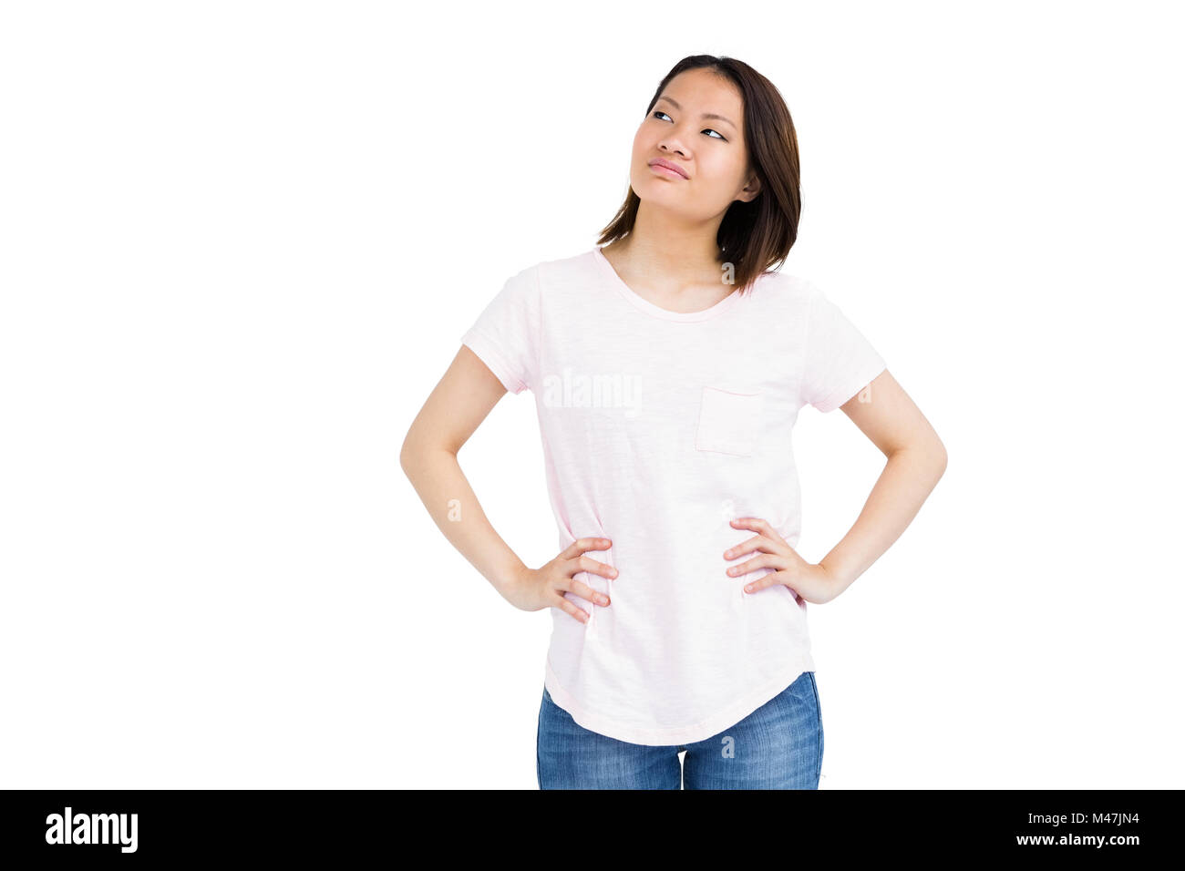 Young woman standing with hands on hip Banque D'Images