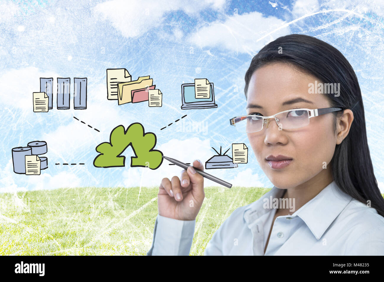 Image composite de l'attractive businesswoman holding pen Banque D'Images