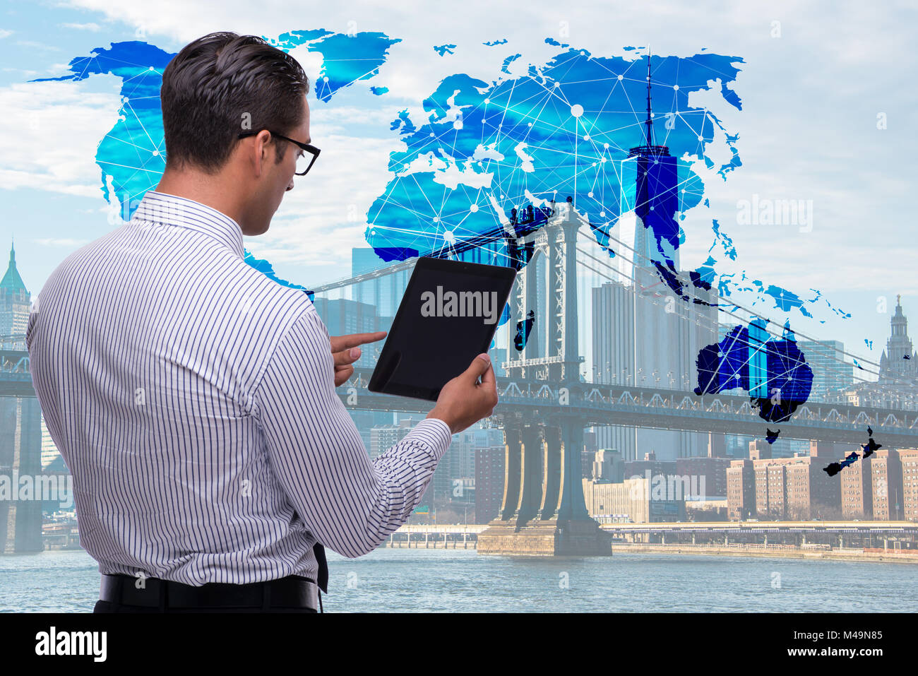 Businessman with tablet in global business concept Banque D'Images