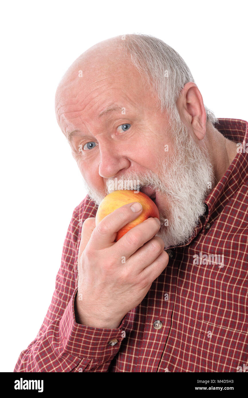 Man souriant manger la pomme, isolated on white Banque D'Images